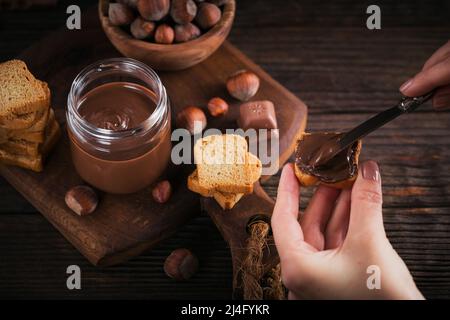 Little Toasts with sweet chocolate spread for breakfast. Stock Photo