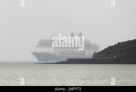 Roches Point, Cork, Ireland. 15th April, 2022. Cruise ships returned to Cobh for the first time in over two years with the arrival of the liner Borealis, seen here entering Cork Harbour in fog at Roches Point, Cork, Ireland.  - Credit; David Creedon / Alamy Live News Stock Photo