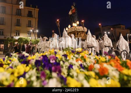 Sorrento, Italy. 14th Apr, 2022. Hooded Penitents of the Arciconfraternita di Santa Monica carry crosses and torches as they take part in Good Friday procession long the streets of Sorrento Southern Italy. Christian believers around the world mark the Holy Week of Easter in celebration of the crucifixion and resurrection of Jesus Christ. Sorrento on April 15, 2022 in Naples, Italy. Credit: Franco Romano/Alamy Live News Stock Photo