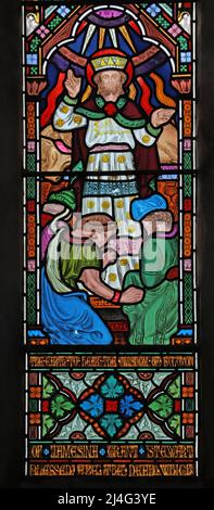 A stained glass window by Frederick Preedy depicting the Wisdom of King Solomon, St Mary's Church, Snettisham, Norfolk Stock Photo