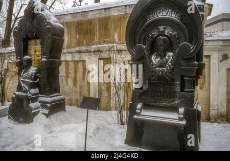 The graves of the composers Borodin and Mussorgsky in the Tikhvin Cemetery at the Alexander Nevsky Monastery in St Petersburg.  Photographed in snow during winter. Stock Photo