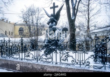 The grave of the composer Tchaikovsky in the Tikhvin Cemetery at the Alexander Nevsky Monastery in St Petersburg.  Photographed in snow during winter. Stock Photo