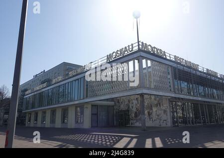 Berlin, Germany. 21st Mar, 2022. 'Mockba' (Moscow) is written in Cyrillic script on Cafe Moskau. Cafe Moskau is a listed building at the corner of Karl-Marx-Allee 34 and Schillingstraße in Berlin's Mitte district. In GDR times it contained a nationality restaurant with selected dishes of some peoples of the Soviet Union and was a popular meeting place. Credit: Alexandra Schuler/dpa/Alamy Live News Stock Photo