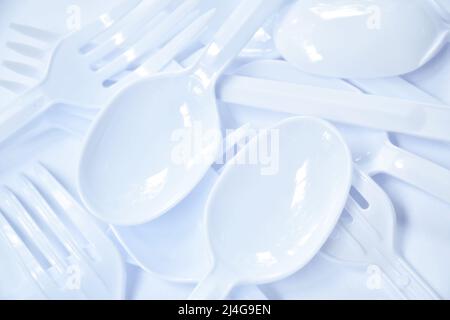 plastic spoon and fork for single used arranging on white background Stock Photo