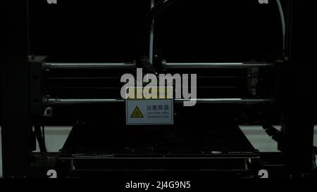 Moscow - Russia, 01.29.2022: close up of Anycubic 3D printer during printing process. HDR. Presentation of a modern technological printing machine. Stock Photo