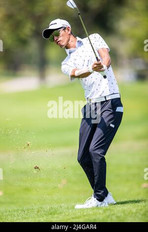 PATTAYA THAILAND - APRIL 14: Chang Wei-lun of Chinese Taipei plays a shot on the 10th hole during the second round of the Trust Golf Asian Mixed Stableford Challenge at Siam Country Club Waterside Course on April 14, 2022 in Pattaya, Thailand. (Photo by Orange Pictures) Stock Photo