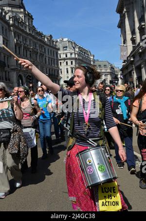 Regent Street, London, UK. 15th Apr 2022. London, UK. 15th Apr, 2022. XR Climate change protester marches down Regent St on a sunny Good Friday afternoon, 15th April 2022. Credit: Mark York/Alamy Live News Stock Photo