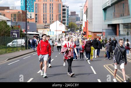 Sheffield United fans make their way to the stadium before the Sky Bet Championship match at Bramall Lane, Sheffield. Picture date: Friday April 15, 2022. Stock Photo