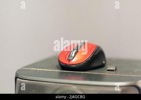 Red computer mouse close-up. Stock Photo