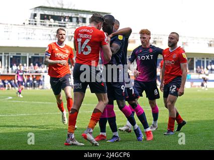 Luton Town's Reece Burke (left) and Nottingham Forest's Keinan Davis have words during the Sky Bet Championship match at Kenilworth Road, Luton. Picture date: Friday April 15, 2022. Stock Photo