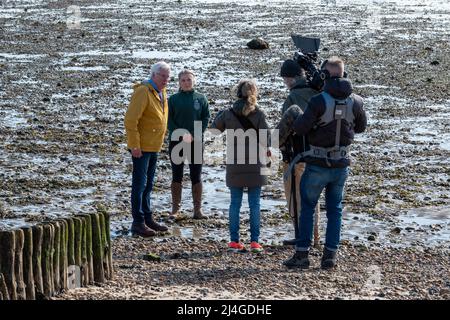 John Craven being filmed for Countryfile on the beach in the Lepe Country Park Hampshire England Stock Photo