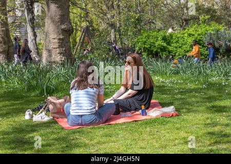 London, UK. 15th Apr, 2022. People take advantage of shade and quiet in St James Park as temperatures reach 22c. Penelope Barritt/Alamy Live News Stock Photo