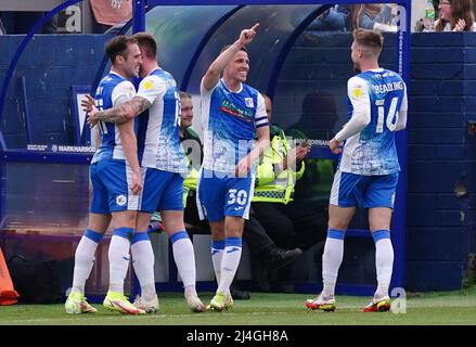 Barrow's John Rooney (centre) celebrates scoring their side's second goal of the game during the Sky Bet League Two match at The Dunes Hotel Stadium, Barrow-in-Furness. Picture date: Friday April 15, 2022. Stock Photo