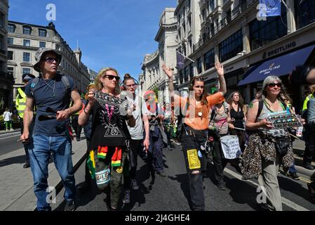 Regent Street, London, UK. 15th Apr 2022. XR Climate change protesters marches down Regent St on a sunny Good Friday afternoon, 15th April 2022. Credit: Mark York/Alamy Live News Stock Photo