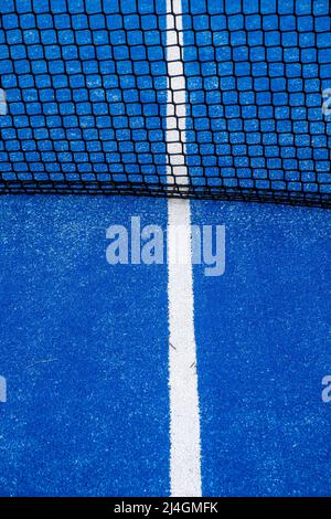 partial view of the netting of a blue paddle tennis court Stock Photo