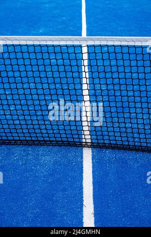 partial view of the netting of a blue paddle tennis court Stock Photo