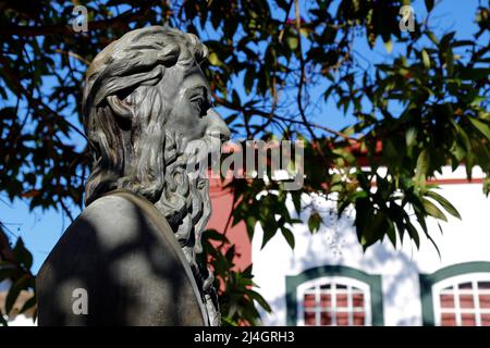 Tiradentes, Minas Gerais, Brazil - July 14, 2021: Tiradentes metal statue representing the ensign on a public road - side view Stock Photo