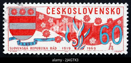 CZECHOSLOVAKIA - CIRCA 1969: a stamp printed in the Czechoslovakia shows Arms of Slovakia, Banner and Blossoms, circa 1969 Stock Photo