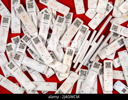 Used Covid-19 Lateral Flow Tests - SARS-CoV-2 Antigen Rapid Tests. Some negative and some positive. Stock Photo