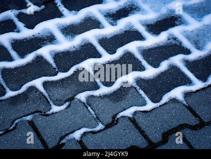 seasonal background snow covered concrete pavement Stock Photo