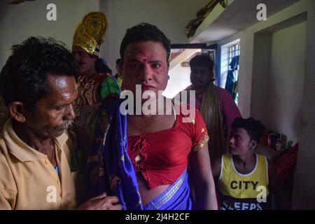 Hoogly, India. 12th Apr, 2022. A cosplayer being prepared for performance during the Gajan festival at Hooghly. Gajan is a Hindu festival celebrated mostly in West Bengal as well as southern part of Bangladesh during the end of the month of Ã¬ChaitraÃ® of the Bengali calendar followed by another festival named Ã¬CharakÃ®. This festival is mainly worshipping Hindu Lord Shiva and Parvati before the start of the harvesting season. Gajan is actually connected to the people who are related to the agricultural community, directly or indirectly. People celebrate by performing rituals such as face p Stock Photo