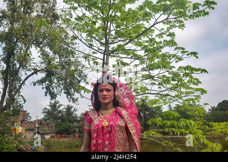 Hoogly, India. 12th Apr, 2022. A cosplayer poses for photos during the Gajan festival at Hooghly. Gajan is a Hindu festival celebrated mostly in West Bengal as well as southern part of Bangladesh during the end of the month of Ã¬ChaitraÃ® of the Bengali calendar followed by another festival named Ã¬CharakÃ®. This festival is mainly worshipping Hindu Lord Shiva and Parvati before the start of the harvesting season. Gajan is actually connected to the people who are related to the agricultural community, directly or indirectly. People celebrate by performing rituals such as face painting and co Stock Photo