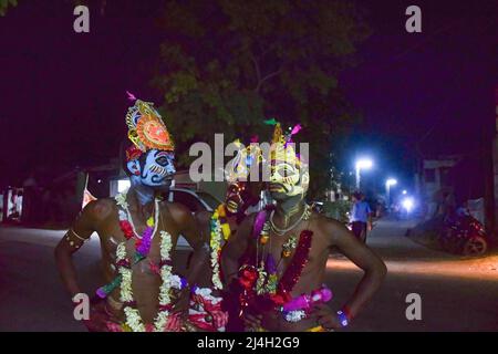 April 12, 2022, bardhaman, India: Devotees seen with painted faces during the Gajan festival at kurmun. Gajan is a Hindu festival celebrated mostly in West Bengal as well as southern part of Bangladesh during the end of the month of Ã¬ChaitraÃ® of the Bengali calendar followed by another festival named Ã¬CharakÃ®. This festival is mainly worshipping Hindu Lord Shiva and Parvati before the start of the harvesting season. Gajan is actually connected to the people who are related to the agricultural community, directly or indirectly. People celebrate by performing rituals such as face painting Stock Photo