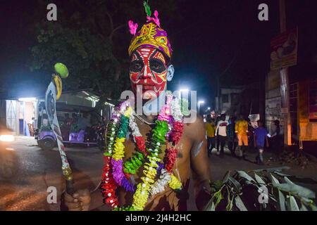 April 12, 2022, bardhaman, India: A devotee seen with a painted face during the Gajan festival at kurmun. Gajan is a Hindu festival celebrated mostly in West Bengal as well as southern part of Bangladesh during the end of the month of Ã¬ChaitraÃ® of the Bengali calendar followed by another festival named Ã¬CharakÃ®. This festival is mainly worshipping Hindu Lord Shiva and Parvati before the start of the harvesting season. Gajan is actually connected to the people who are related to the agricultural community, directly or indirectly. People celebrate by performing rituals such as face paintin Stock Photo