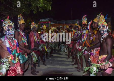 April 12, 2022, bardhaman, India: Devotees seen with painted faces during the Gajan festival at kurmun. Gajan is a Hindu festival celebrated mostly in West Bengal as well as southern part of Bangladesh during the end of the month of Ã¬ChaitraÃ® of the Bengali calendar followed by another festival named Ã¬CharakÃ®. This festival is mainly worshipping Hindu Lord Shiva and Parvati before the start of the harvesting season. Gajan is actually connected to the people who are related to the agricultural community, directly or indirectly. People celebrate by performing rituals such as face painting Stock Photo