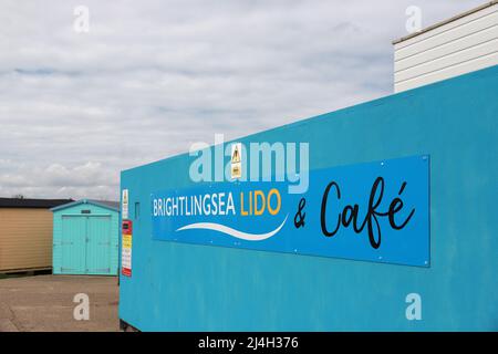 A sign announcing the Brightlingsea Lido and Cafe, Brightlingsea seafront, Essex Stock Photo