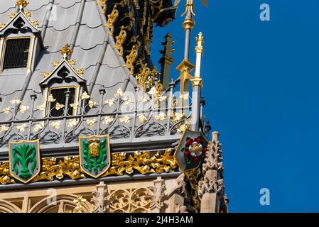 Upper detail of recently uncovered restored Elizabeth Tower, Big Ben, of the Palace of Westminster, London. Bright colours. Ornate features of spire Stock Photo