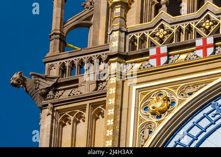 Upper detail of recently uncovered restored Elizabeth Tower, Big Ben, of the Palace of Westminster, London. Bright colours. Ornate features of spire Stock Photo