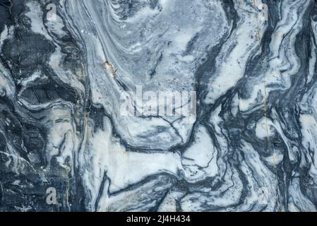 Cut of natural Karelian old marble close-up Stock Photo