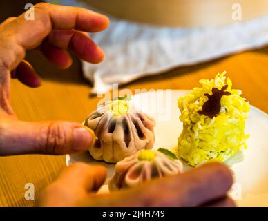 Preparation of moon viewing tsukimi, traditional Japanese sweets eaten every year on the occasion of the full moon in autumn and decorated with a rabbit. Izu, Japan
