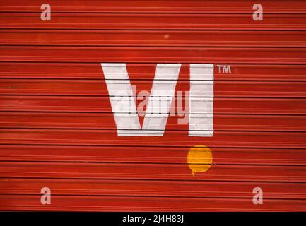 The Vodafone Idea logo seen on the shutter of a shop in Mumbai. Vodafone Idea is pan India Global System for Mobile communication (GSM) company offering 2G, 3G, 4G and VoWiFi to its customers across the country. Stock Photo