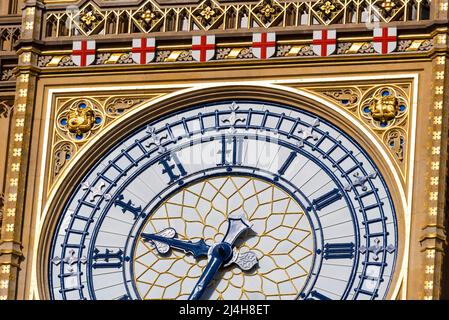 Upper detail of recently uncovered restored Elizabeth Tower, Big Ben, of the Palace of Westminster, London. Bright colours. Ornate features of spire Stock Photo