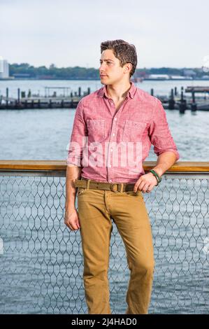 Man Wearing Yellow Long-sleeved Shirt and Red Pants Under Clear Blue Sky ·  Free Stock Photo