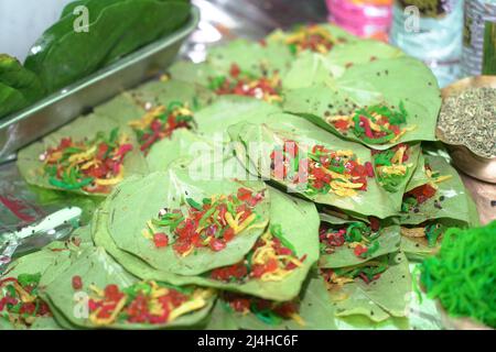 close up photo of a garnished banarasi pan, an indian mouth freshner delicacy made with betel leaves. Stock Photo