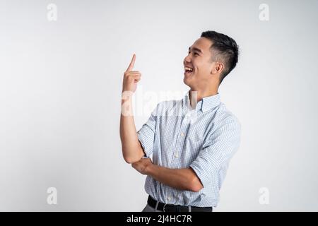 excited young man with fingers pointing up Stock Photo