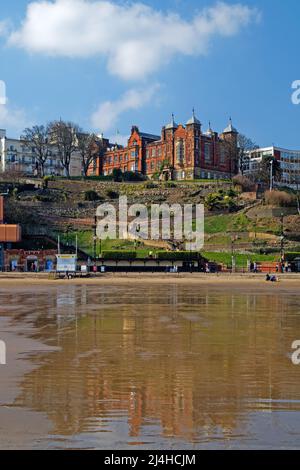 UK, North Yorkshire, Scarborough, Town Hall, St Nicholas Gardens and Foreshore Road from South Bay Beach at low tide. Stock Photo