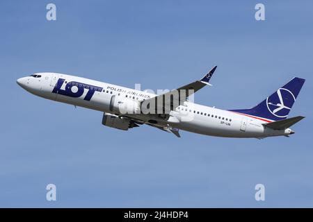 A Boeing 737 MAX operated by LOT departs from London Heathrow Airport Stock Photo