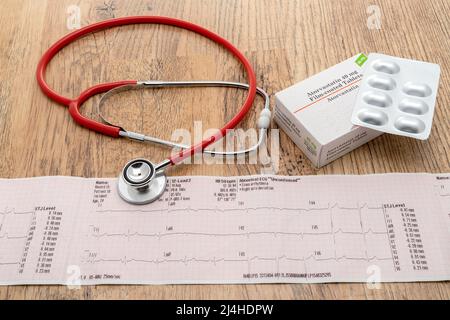 A heart trace ECG with a generic box of Statin pills and a stethoscope Stock Photo