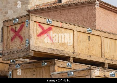 foreground in horizontal view of some large wooden boxes stacked for transportation artworks and exhibitions material Stock Photo