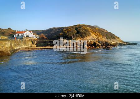 UK, North Yorkshire, Scarborough, Scalby Mills Beach, Headland and Old Scalby Mills Pub. Stock Photo