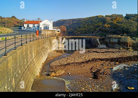 UK, North Yorkshire, Scarborough, Scalby Mills Beach and Old Scalby Mills Pub. Stock Photo