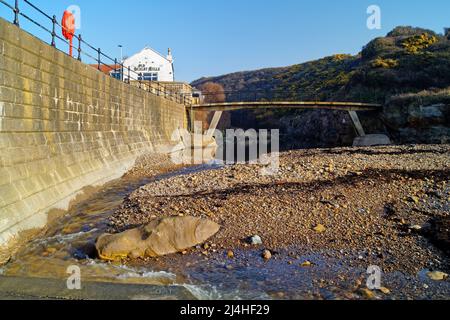 UK, North Yorkshire, Scarborough, Scalby Mills Beach and Old Scalby Mills Pub. Stock Photo