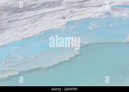 Natural travertine pools and terraces view from Pamukkale, Denizli, Turkey. Cotton castle close up view. Stock Photo