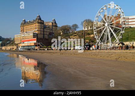 UK, North Yorkshire, Scarborough, Reflections of Grand Hotel on South Bay Beach Stock Photo