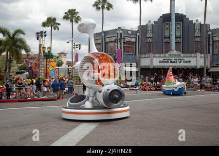 Islands Of Adventure, Orlando, Florida, USA, April 4th 2022, Locals and tourists view the 'Mardi Gras' Parade at the theme park Stock Photo