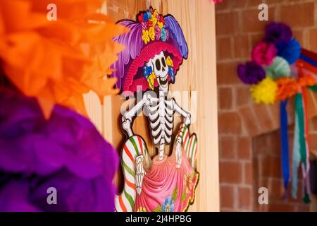 A funny skeleton decorates the door of a classroom on the day of the dead. Stock Photo